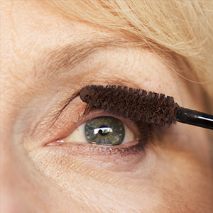 Sally applying mascara